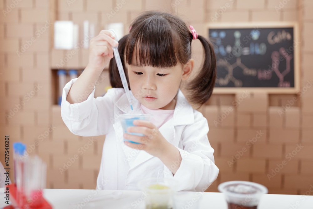 young girl plays science experiment for home schooling young girl plays science experiment for home schooling