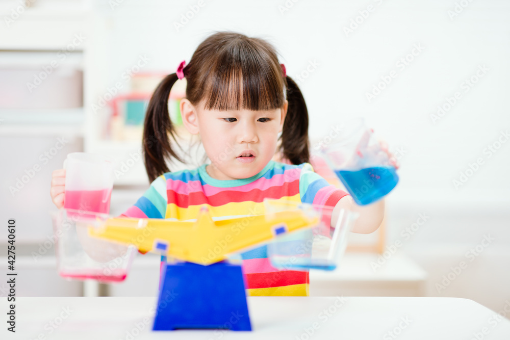 young girl play balance toy for homeschooling young girl play balance toy for homeschooling