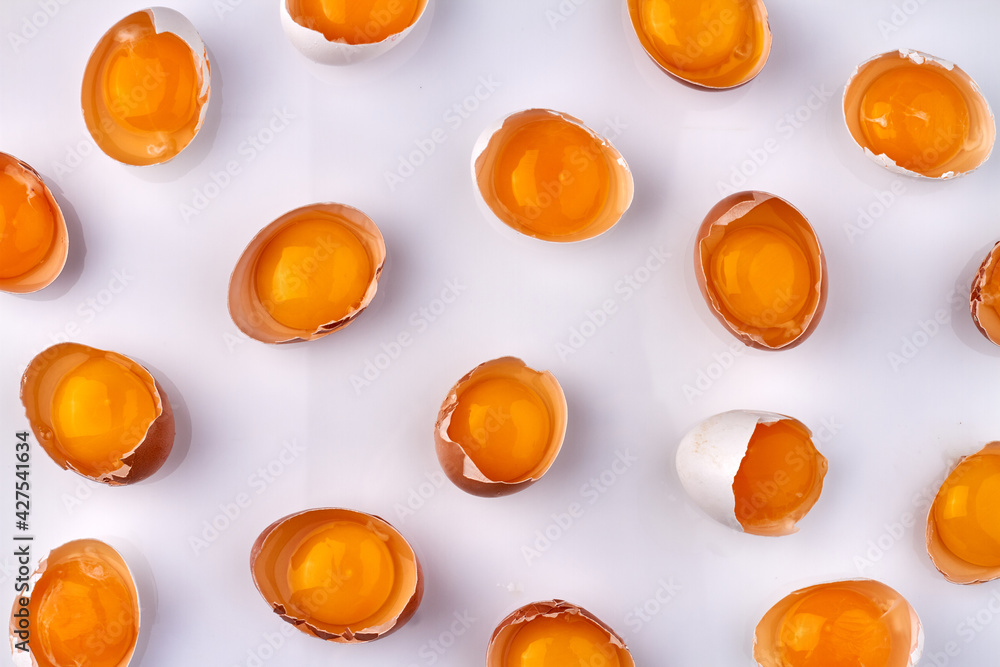 Arrangement of chicken eggshells with yolk.