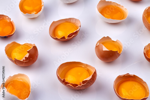 Broken eggshells with fresh yolk. photo