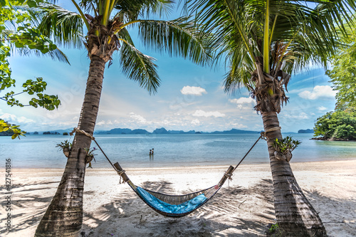 dream beach thailand with palm tree hammock and white sand for lovers 