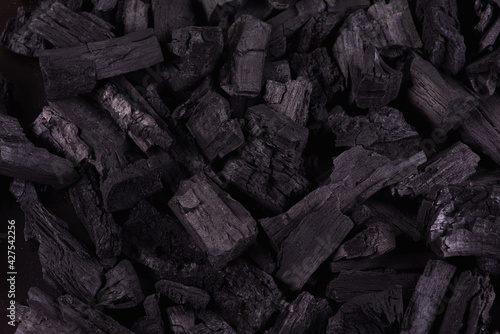 Black mineral coal as a cubic stone background. Coal scheme. Low key. Black coal