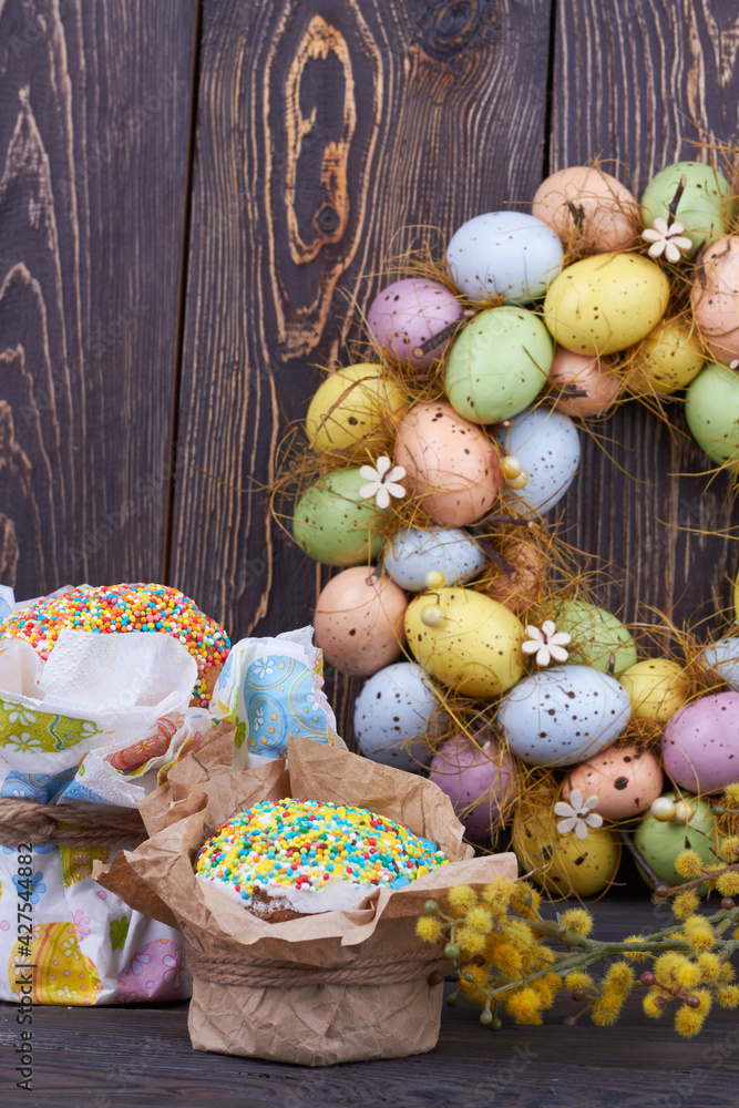 Colorful eggs with cakes and willow.