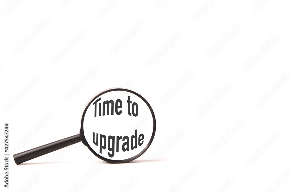 Magnifying glass written with text TIME TO UPGRADE over white background. Magnifying glass written with text TIME TO UPGRADE over white background.