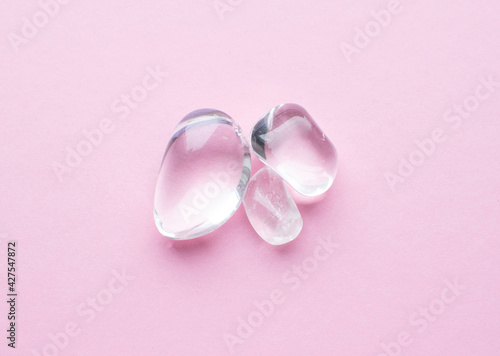 Beautiful round cut rhinestone stones on a pink background. Natural minerals for meditation.