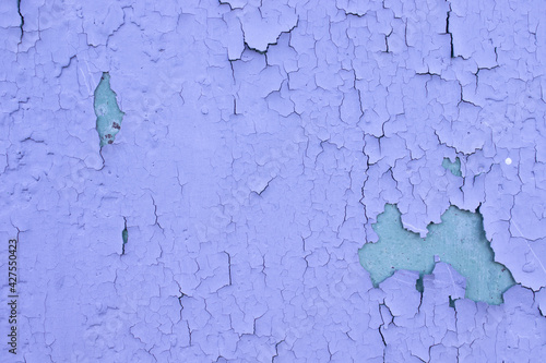 Cracked blue oil paint on aged metal surface. Cool grunge crackle texture. Fractured pattern. Peeling paint on Old wall. close up