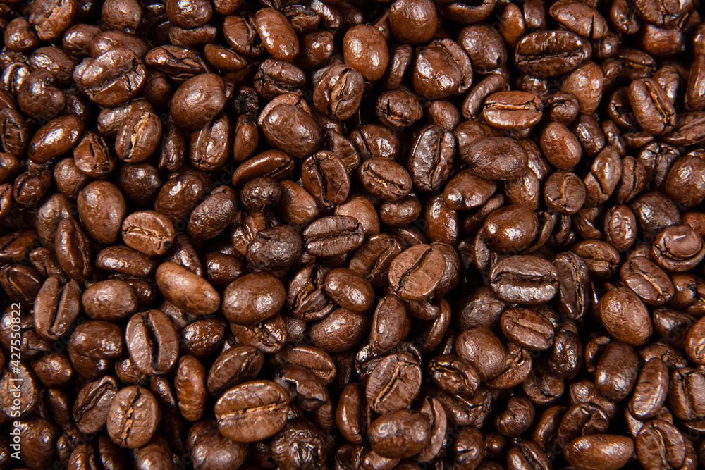 Freshly roasted coffee beans background. close up. Freshly roasted coffee beans background. close up.