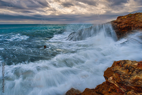 waves crashing on rocks