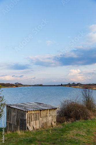 Vertical shot of a small hut near the Lake Jarkovci, Indjija, Serbia photo