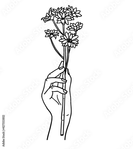Hand holding flowers