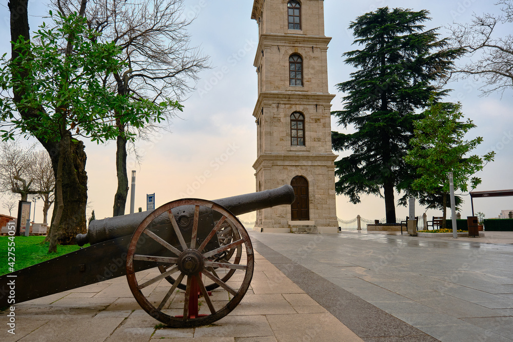 29.03.2021. Bursa Turkey. Photo in Tophane district during overcast weather. Old and vintage style gun and clock tower established during ottoman empire period background