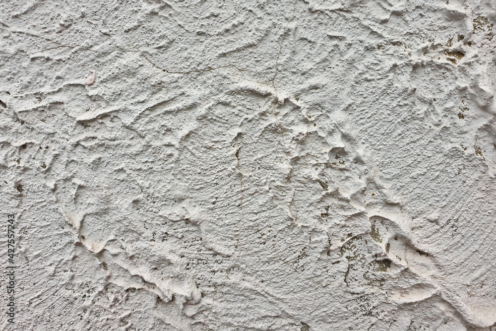 textured colored facing plaster of the street wall of the building