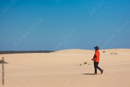 The man in red in the desert