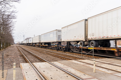 Chicago, Illinois - March 12, 2021: Cargo Train Passes Through Downers Grove in Chicago.