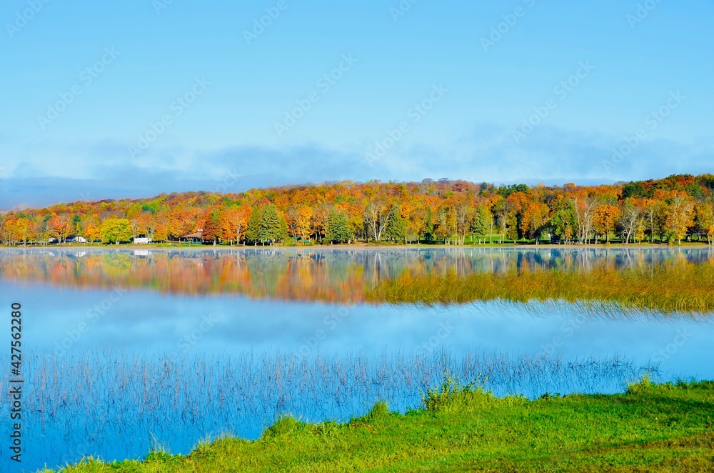 Fototapeta premium Autumn landscape with lake and trees in Northern Michigan 