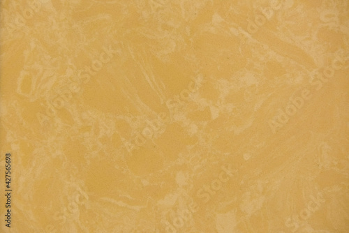 yellow stone marble background pattern. Top view. Copy space.