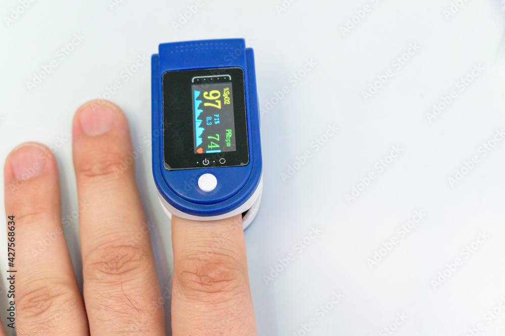 A person finger is inserted into the device. Pulse oximetry is a noninvasive method for monitoring a person's oxygen saturation. A person finger is inserted into the device. Pulse oximetry is a noninvasive method for monitoring a person's oxygen saturation.