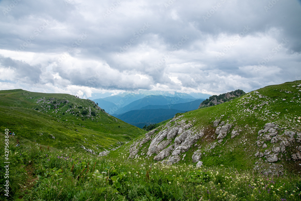 Fototapeta premium summer landscape panoramic view on a cloudy day in the valley mountains. Adygea, Russia