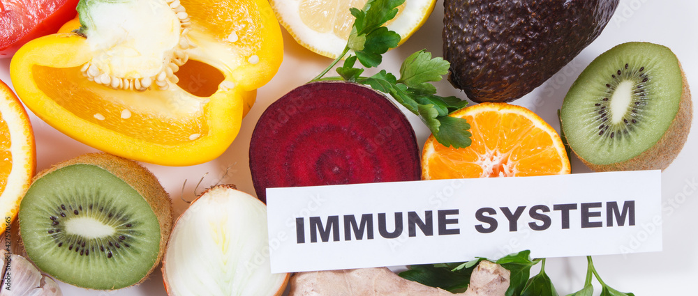 Inscription immune system, fresh healthy fruits and vegetables containing vitamins. Immune boosting in times of Covid-19 Inscription immune system, fresh healthy fruits and vegetables containing vitamins. Immune boosting in times of Covid-19