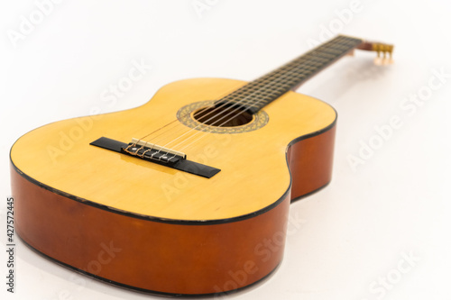 Close up acoustic guitar isolated on white background