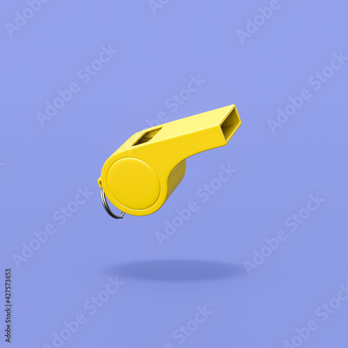 Yellow Plastic Whistle on Blue Background photo