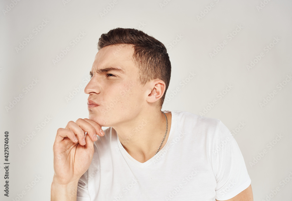 Male puzzled look face sleeves model white t-shirt Male puzzled look face sleeves model white t-shirt