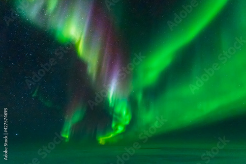 Colourful aurora display taken from an aeroplane photo