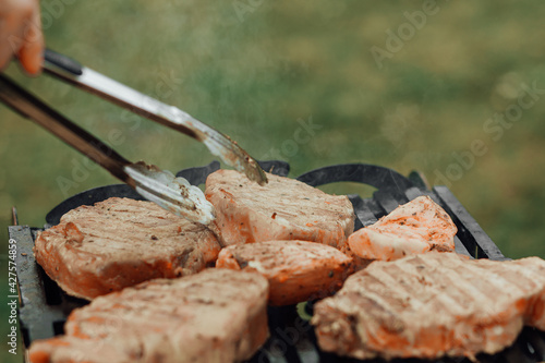 Assorted delicious grilled meat with vegetables over the coals on a barbecue