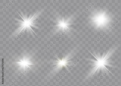 White glowing light explodes on a transparent background. Sparkling magical dust particles. Bright Star.