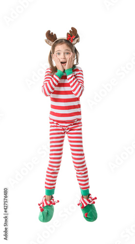 Surprised jumping little girl in Christmas elf costume on white background