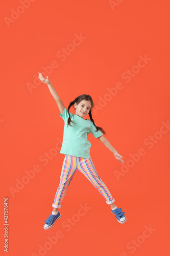 Jumping little girl on colo...
