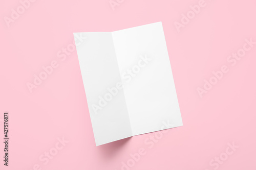 Blank brochure on color background © Pixel-Shot