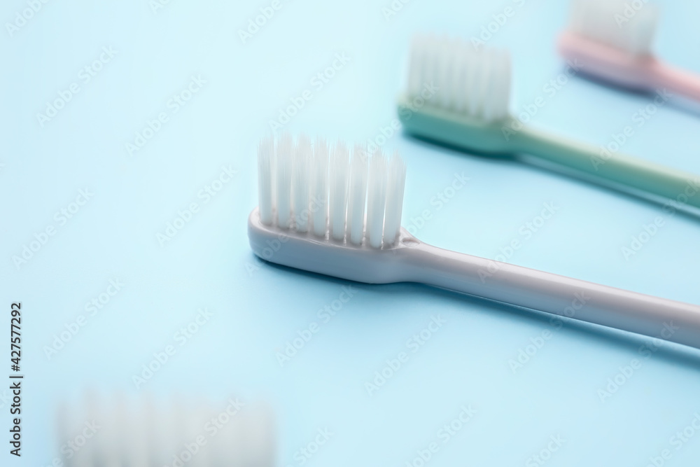 Tooth brushes on color background Tooth brushes on color background