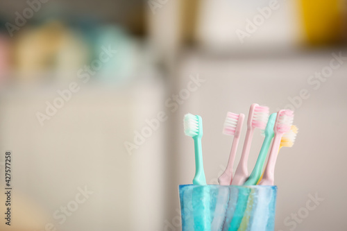 Tooth brushes on blurred background