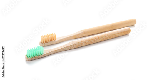 Wooden tooth brushes on white background