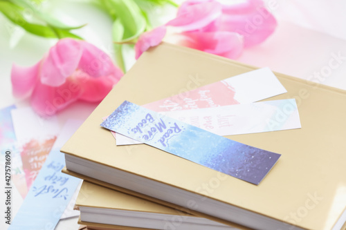 Books with bookmarks and fl...