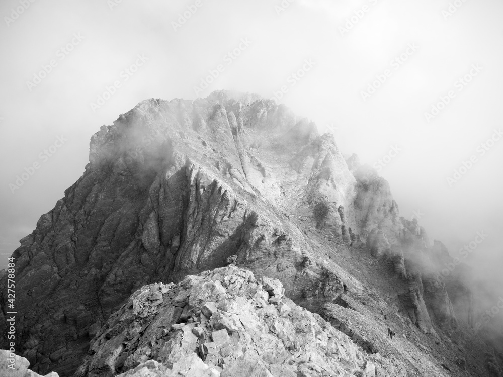 mytikas peak in fog black and white photo