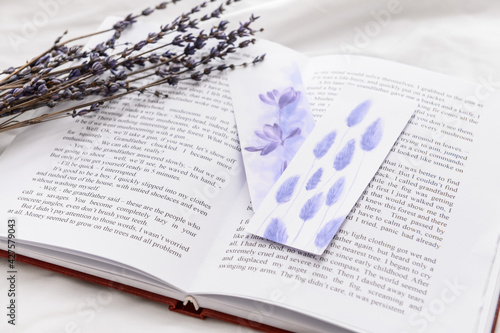 Book with bookmarks and lav...