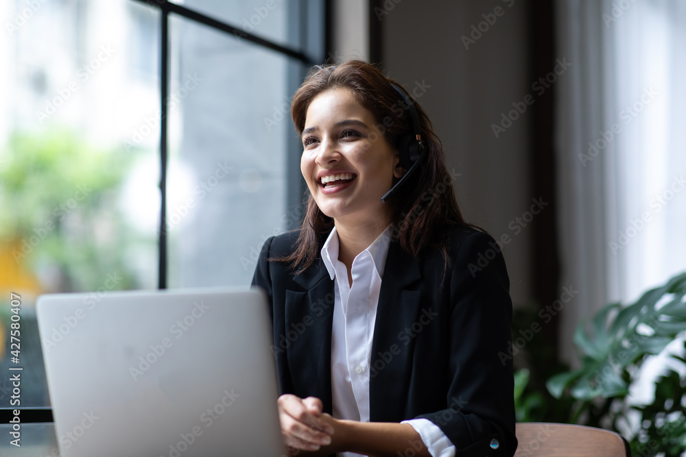 Ταπετσαρία Attractive business woman Asian in suits and headsets are smiling while working with computer at office