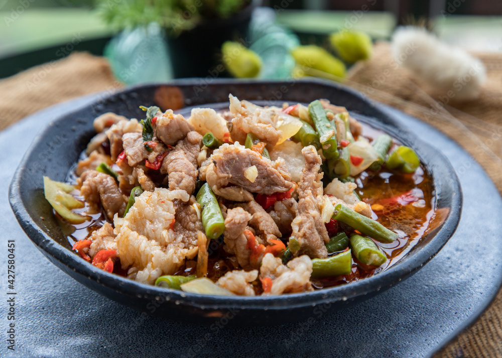Stir fried pork with Roasted red chili paste on Ceramic plate. Selective focus. Stir fried pork with Roasted red chili paste on Ceramic plate. Selective focus.
