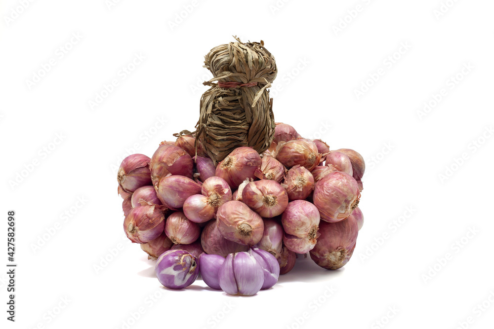 Whole bunch of Shallot and Peeled is a Thai herb and cooking ingredients isolated on white background.