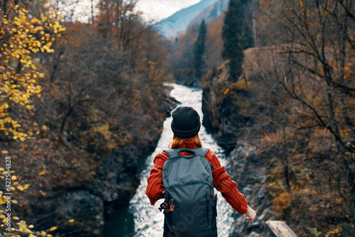 Tela woman hiker backpack mountains river fresh air