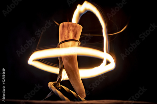 Drinking horn with fire band forming a circle light painting photo