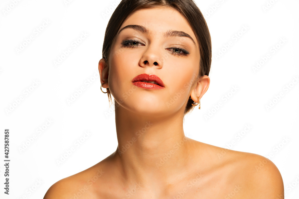 A young beautiful woman with blue eyes and tied hair A young beautiful woman with blue eyes and tied hair
