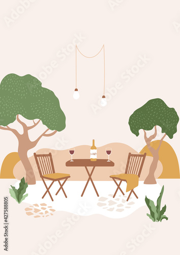 Courtyard in ranch, summer outdoor party, romantic meeting, red wine glass and bottle on table in garden, chairs with blanket. Evening outside relax, authentic cozy landscape scene. 