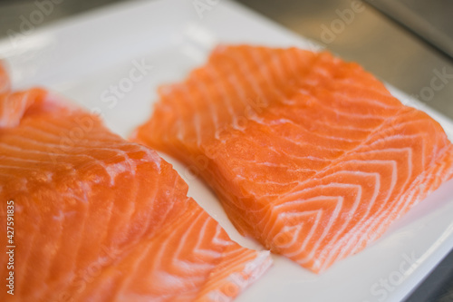 large pieces of fresh salmon on the table