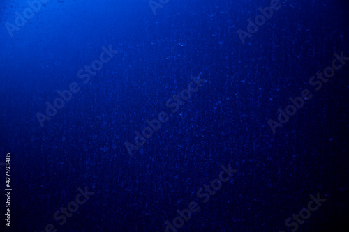 Abstract grunge dark blue background, textured, space for text, space for copy