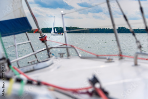 view from a main deck of sailboat on a lake. Summer vacations, cruise, recreation