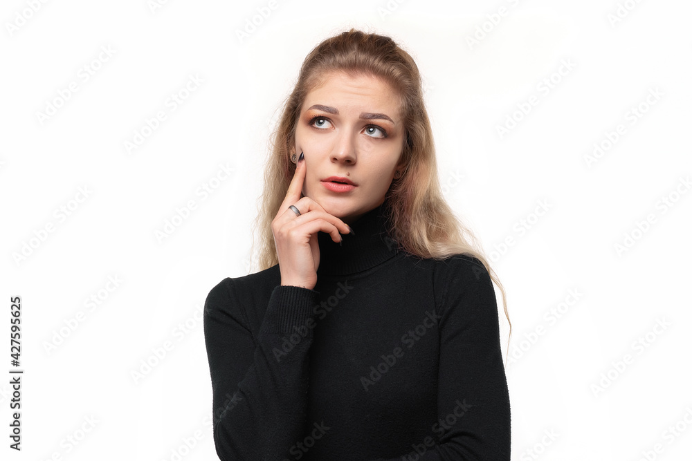 Close up girl with a concentrated look, wondering with a doubtful expression, looking up and to the side, isolated Close up girl with a concentrated look, wondering with a doubtful expression, looking up and to the side, isolated