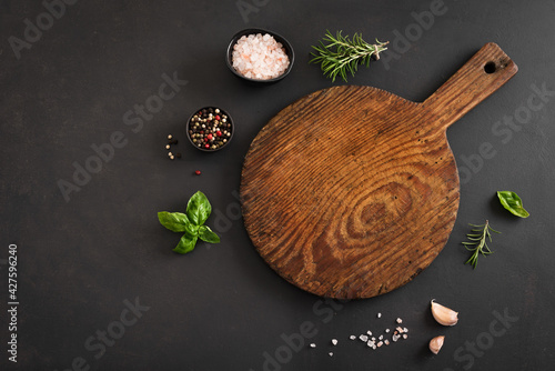 Empty wooden  board on black table photo